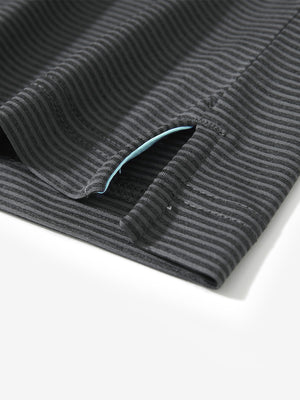 Detail view of hem on light and dark grey comfy breathable pin-stripe texture golf polos