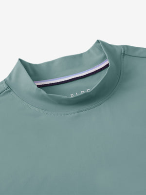 Detail view of mock neck on dusty blue women's moisture-wicking mock neck sleeveless golf tops