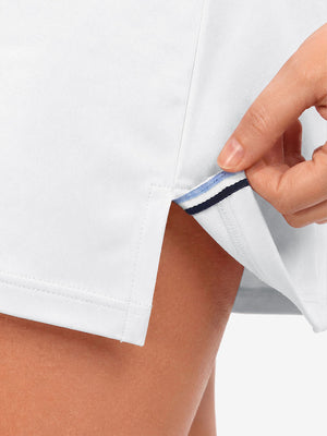 Hem stitching detail close-up in white of women's lightweight golf dress with 2 pockets.