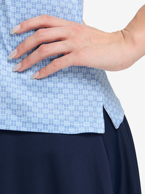Detail view of hem on  blue plaid women's sleeveless q-zip print quick dry golf tops