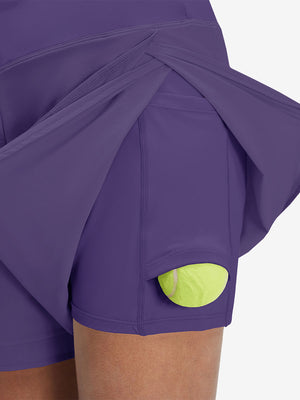 Detail view of side inner pocket on dark purple women's gym golf shorts with liner pocket