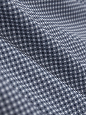 Close-up texture of dark blue diamond premium ribbed collar print polo shirts fabric showing detailed premium material and weave.