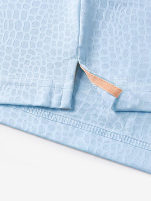 Hem detail close-up in light blue of nylon blend casual jacquard polo shirts.