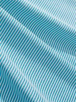 Close-up texture of blue white comfy breathable pin-stripe texture golf polos fabric showing weave detail.