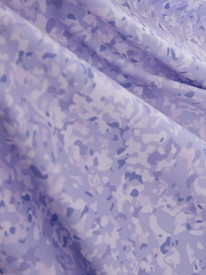 Close-up texture of lavender rose women's sleeveless q-zip print quick dry golf tops fabric showing detailed print and quick dry weave.