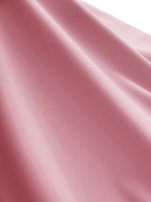 Close-up texture of lavender women's moisture-wicking mock neck sleeveless golf tops fabric showing breathable weave detail.