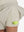 Detail view of side inner pocket on oyster gray women's gym golf shorts with liner pocket