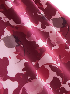 Close-up texture of red splatter women's sleeveless q-zip print quick dry golf tops fabric showing detailed print and quick dry weave.