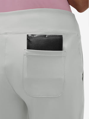 Back view of pocket on silver gray women's high waist stretch golf pants with pockets