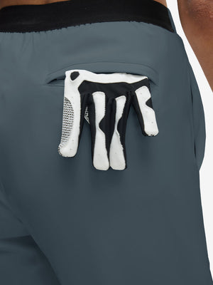Back view of pocket on grey blue women's lightweight athletic sweatpants
