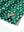 Close-up of the hem vent on the golf vacation 4 way stretch print collared polo shirt, showing the side split for movement