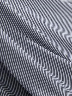 Close-up texture of navy white comfy breathable pin-stripe texture golf polos fabric showing weave detail.