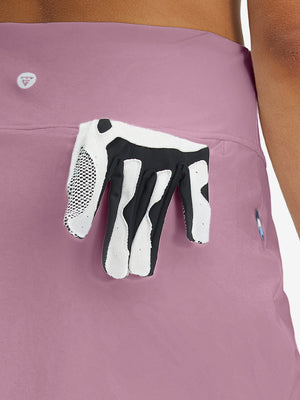 Back view of pocket on lavender pink high waist built-in short a-line golf skirt with 5 pockets