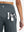 Back side view of pocket on dark grey women's high waist 2 in 1 quick dry shorts with 7 pockets