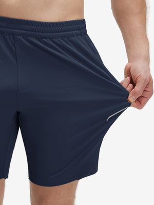 View showing loose fit of navy 4 way stretch breathable workout athletic shorts
