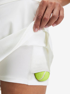 Inside view of pocket on white high waist built-in short a-line golf skirt with 5 pockets