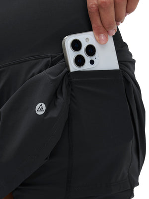 Detail view of inner pocket on black women's stretch a-line golf skort with 7 pockets