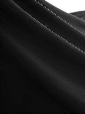 Close-up texture of black women's high waisted golf skirts with 4 inner pockets fabric showing detailed material and weave.