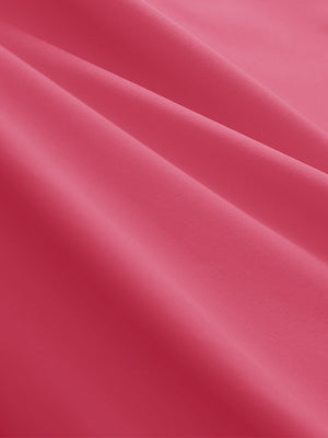 Close-up texture of rose women's 5 buttons collared polo shirts fabric showing detailed knit weave.