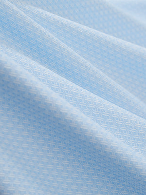 Close-up texture of light blue moisture wicking jacquard golf shirts fabric showing detailed jacquard weave and wicking texture.