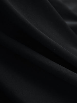 Close-up texture of black women's 5 buttons collared polo shirts fabric showing detailed knit weave.