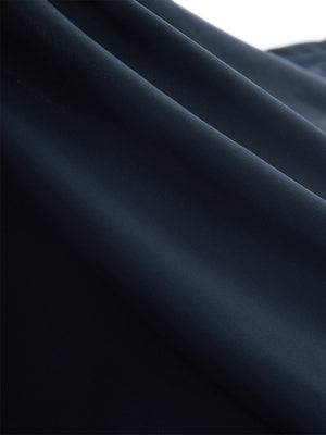 Close-up texture of navy blue women's high waisted golf skirts with 4 inner pockets fabric showing detailed material and weave.