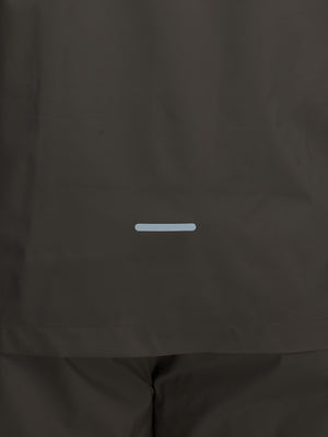 Back hem reflective detail of khaki grey waterproof lightweight rain jacket with hood