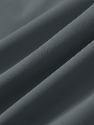 Close-up texture of dark grey 4 way stretch breathable workout athletic shorts fabric showing weave detail.