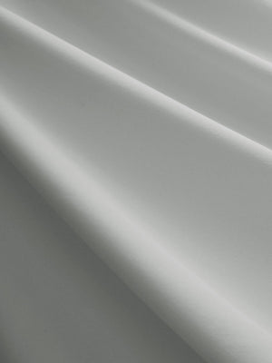 Close-up texture of light grey women's breathable 1/4 zip pullover golf shirts fabric showing breathable weave detail.