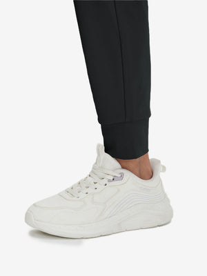 Detail view of hem on black women's lightweight athletic sweatpants