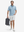 Front full body shot of model wearing white blue abstract stylish full print contrast collared golf polo shirts