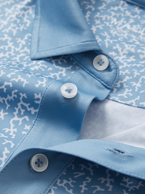 Detail view of collar on white blue abstract stylish full print contrast collared golf polo shirts