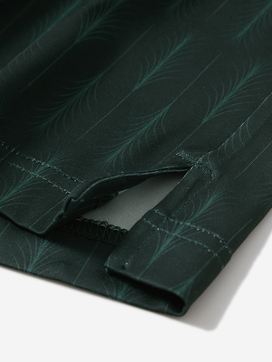 Detail view of hem on green palm leaves stylish full print contrast collared golf polo shirts