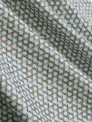 Close-up texture of hexagon grid stylish full print contrast collared golf polo shirts fabric showing weave detail.