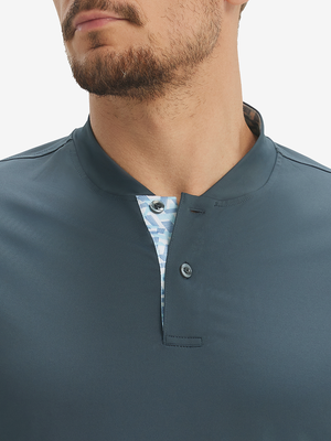 Close-up of model in dark grey moisture-wicking short sleeve henley shirt, nose to chest front view.