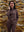 Full body influencer-style shot by stone wall, women's lightweight hoodies pullover styled in modern coffee brown look