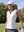Model on outdoor golf course wearing white women's collared v neck quick dry tank tops